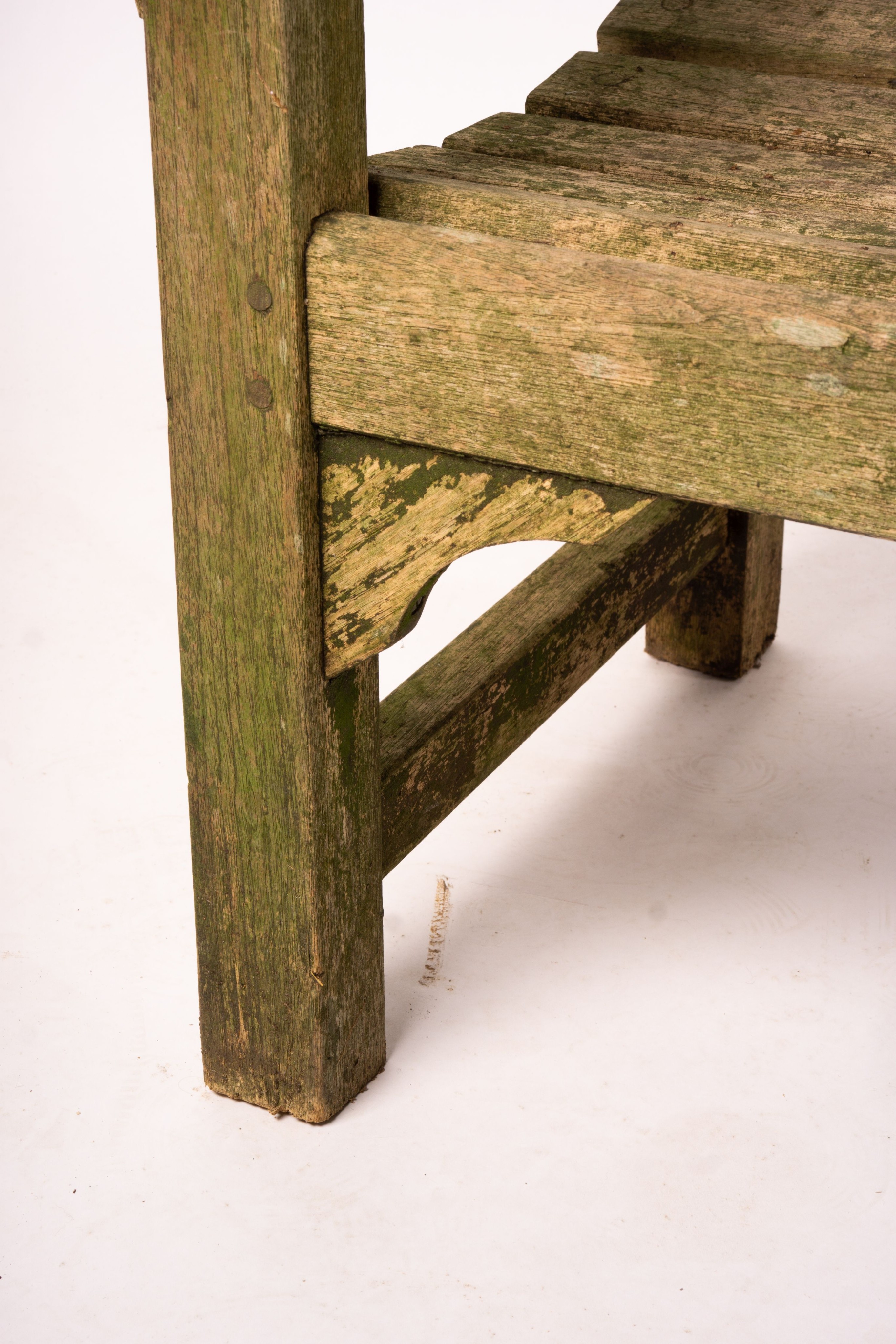 A weathered teak garden bench, length 192cm, width 60cm, height 85cm